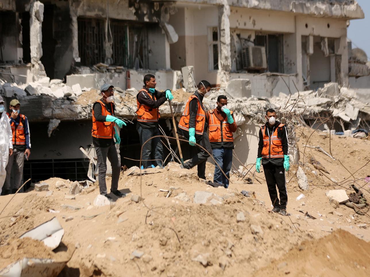 Rescuers and medics search for dead bodies inside the damaged Al Shifa Hospital after Israeli forces withdrew from the hospital and the area around it following a two-week operation, amid the ongoing conflict between Israel and Hamas, in Gaza City April 8, 2024. REUTERS/Dawoud Abu Alkas