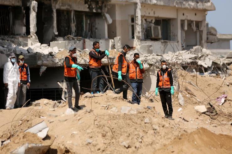 Rescuers and medics search for dead bodies inside the damaged Al Shifa Hospital after Israeli forces withdrew from the hospital and the area around it following a two-week operation, amid the ongoing conflict between Israel and Hamas, in Gaza City April 8, 2024. REUTERS/Dawoud Abu Alkas