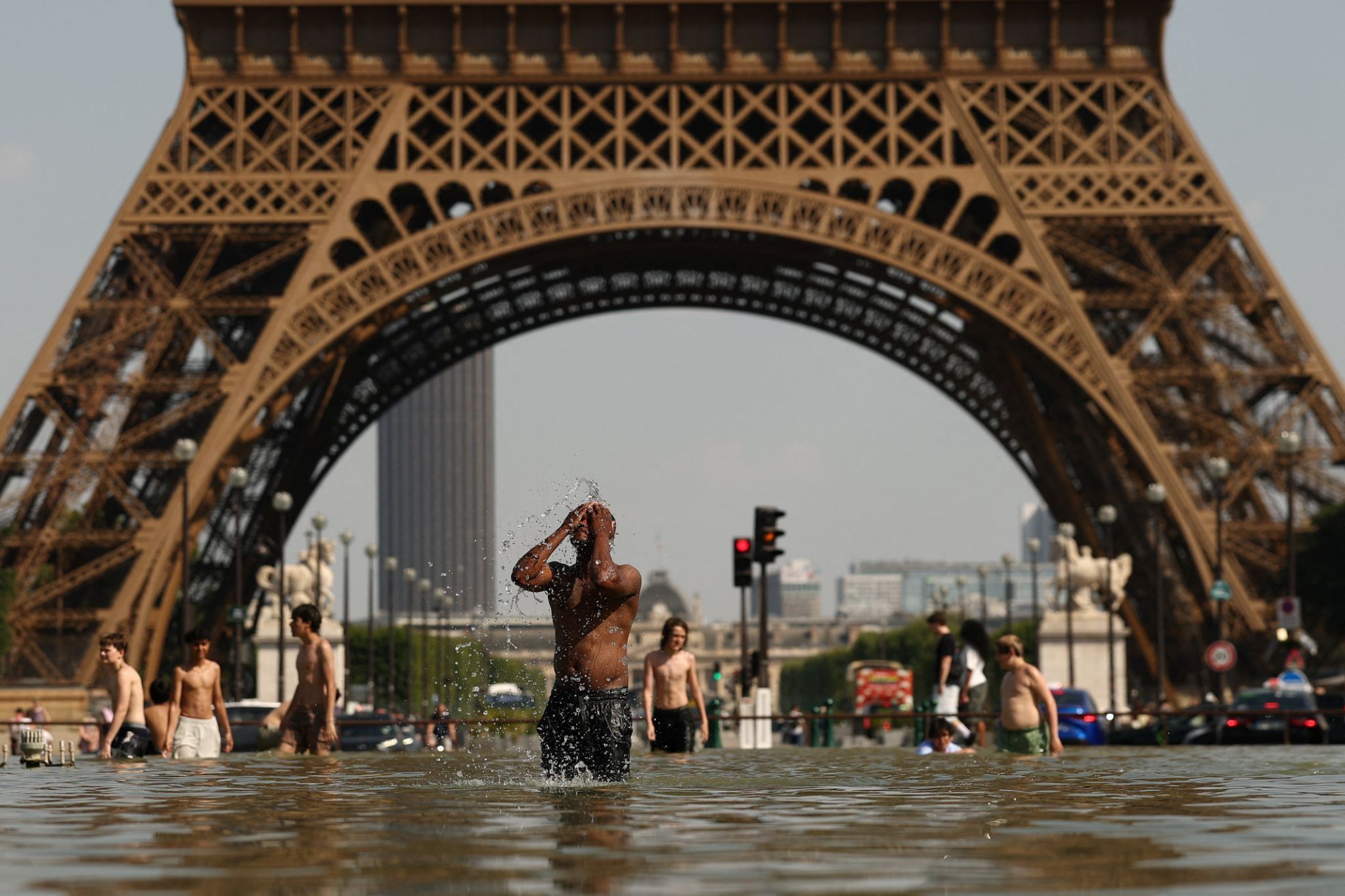 A man bathes in the Trocadero Fountain in Paris