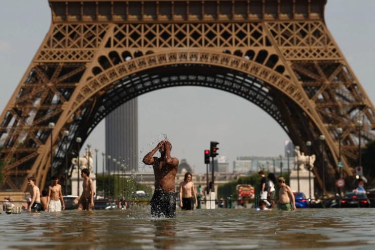 A man bathes in the Trocadero Fountain in Paris