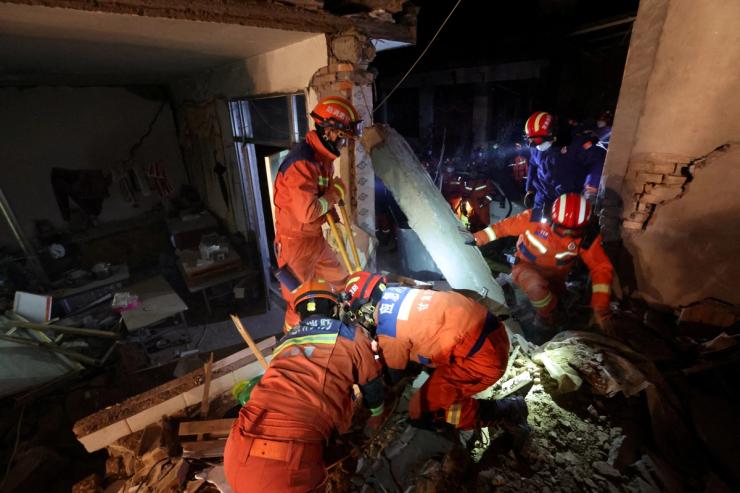 Rescue workers conduct search and rescue operations at Kangdiao village following the earthquake in Jishishan county, Gansu province, China December 19, 2023.