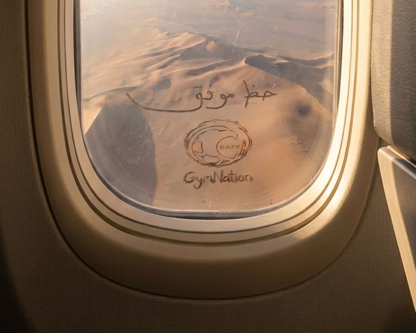 An image of the message carved in the sand.