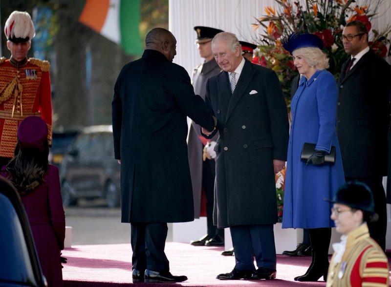President Cyril Ramaphosa, of South Africa, shakes hands with King Charles III as Camilla, the Queen Consort, looks on before they inspect a Guard of Honour during the ceremonial welcome for his State Visit to the UK at Horse Guards Parade.