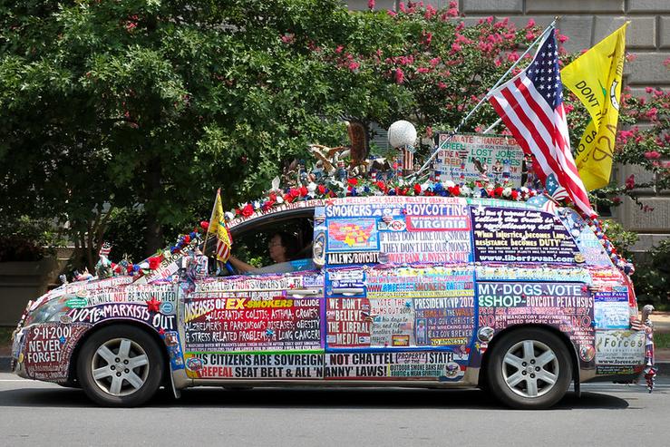 A car covered in political bumper stickers
