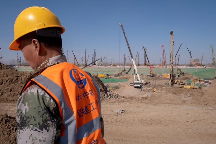 A worker of China Railway is seen at the construction site for the Xiongan station of the new railway connecting Beijing to Xiongan New Area, in Hebei province, China