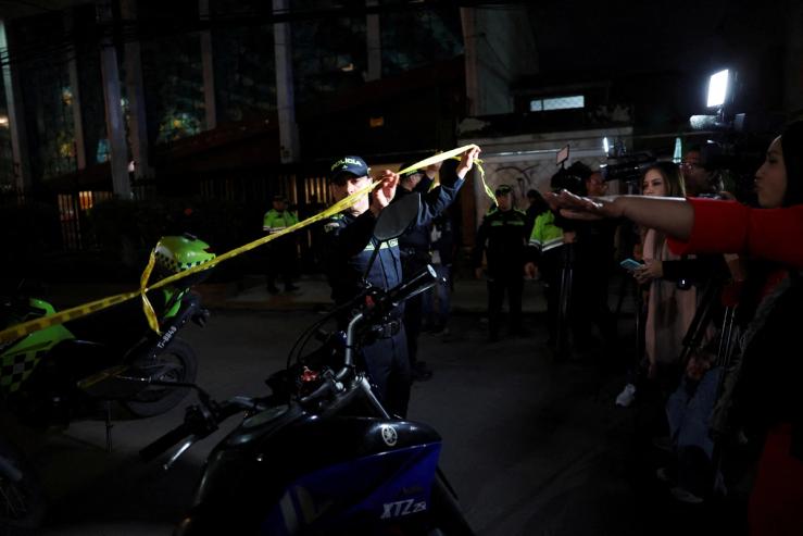 Police officers cordon off the area where Colombian Senator Miguel Uribe Turbay was shot.