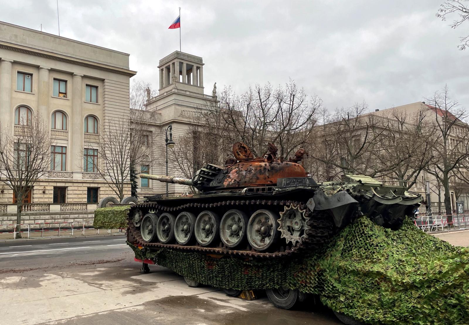 Remains of a destroyed Russian T-72 tank, secured from the Ukrainian village of Dmytrivka, outside Kyiv are on display near the Russian embassy at Unter den Linden boulevard, during an event to mark the one-year anniversary of the Russian invasion of Ukraine, in Berlin, Germany, February 24, 2023. REUTERS/Oliver Denzer