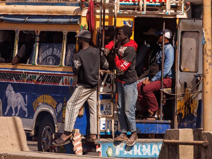 People riding a bus in Dakar.