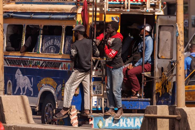 People riding a bus in Dakar.