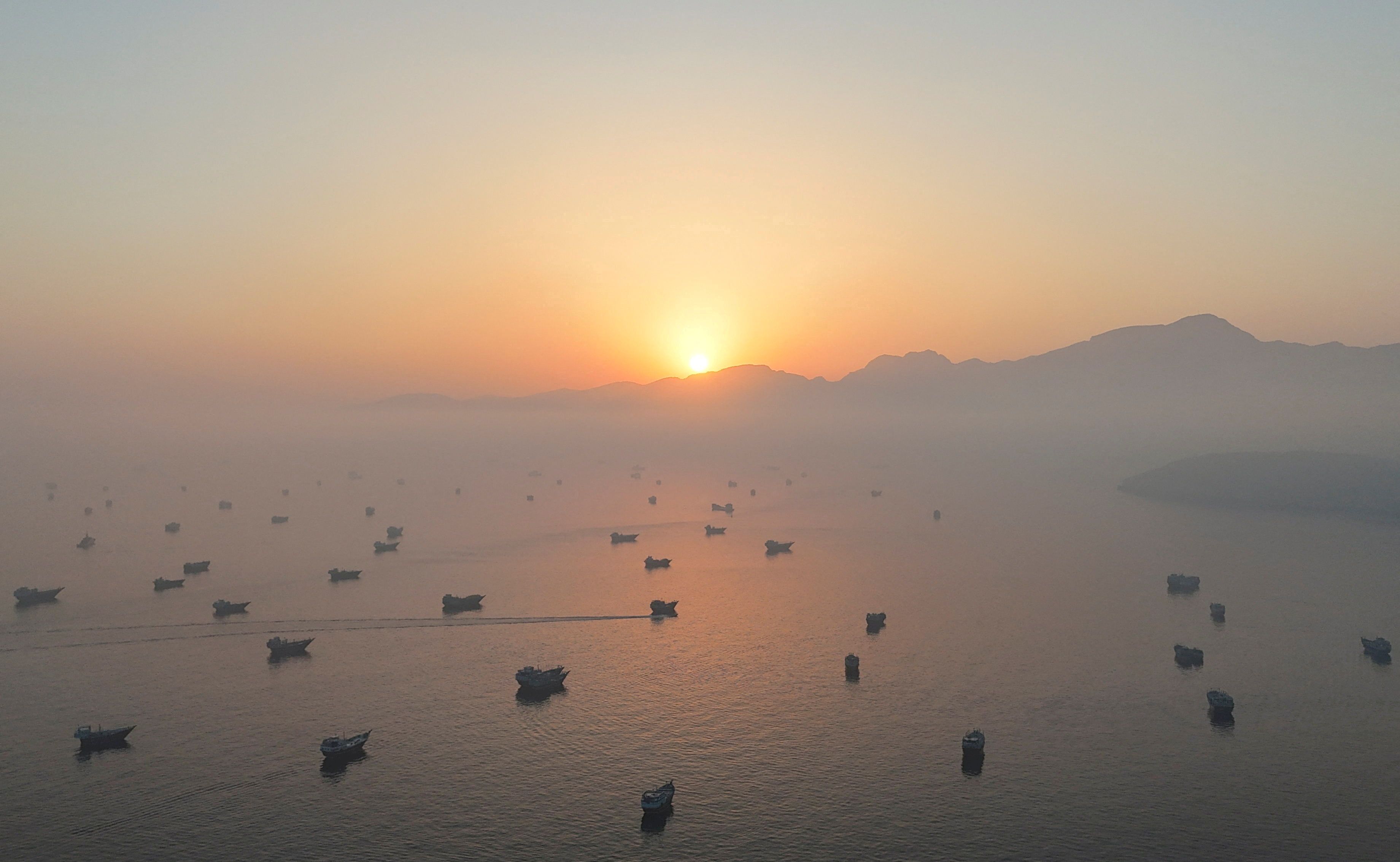 A drone view shows vessels in the Strait of Hormuz