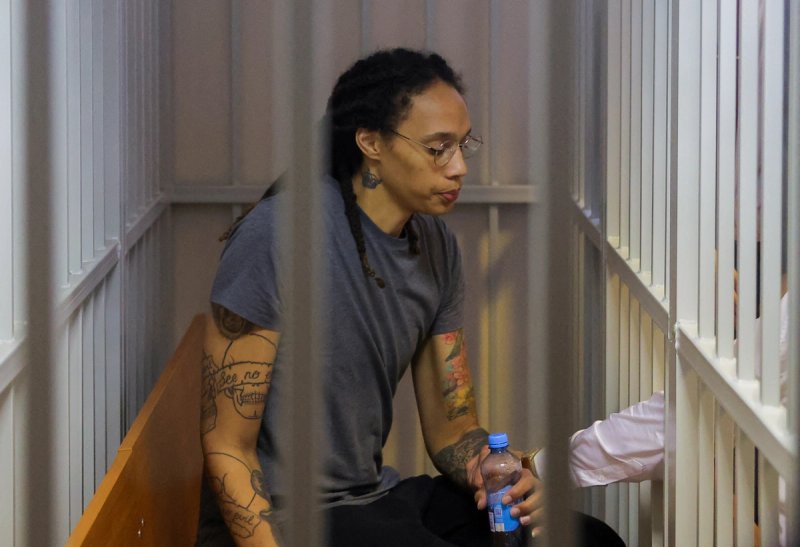 Brittney Griner sits inside a defendants' cage after the court's verdict in Khimki outside Moscow, Russia August 4, 2022.