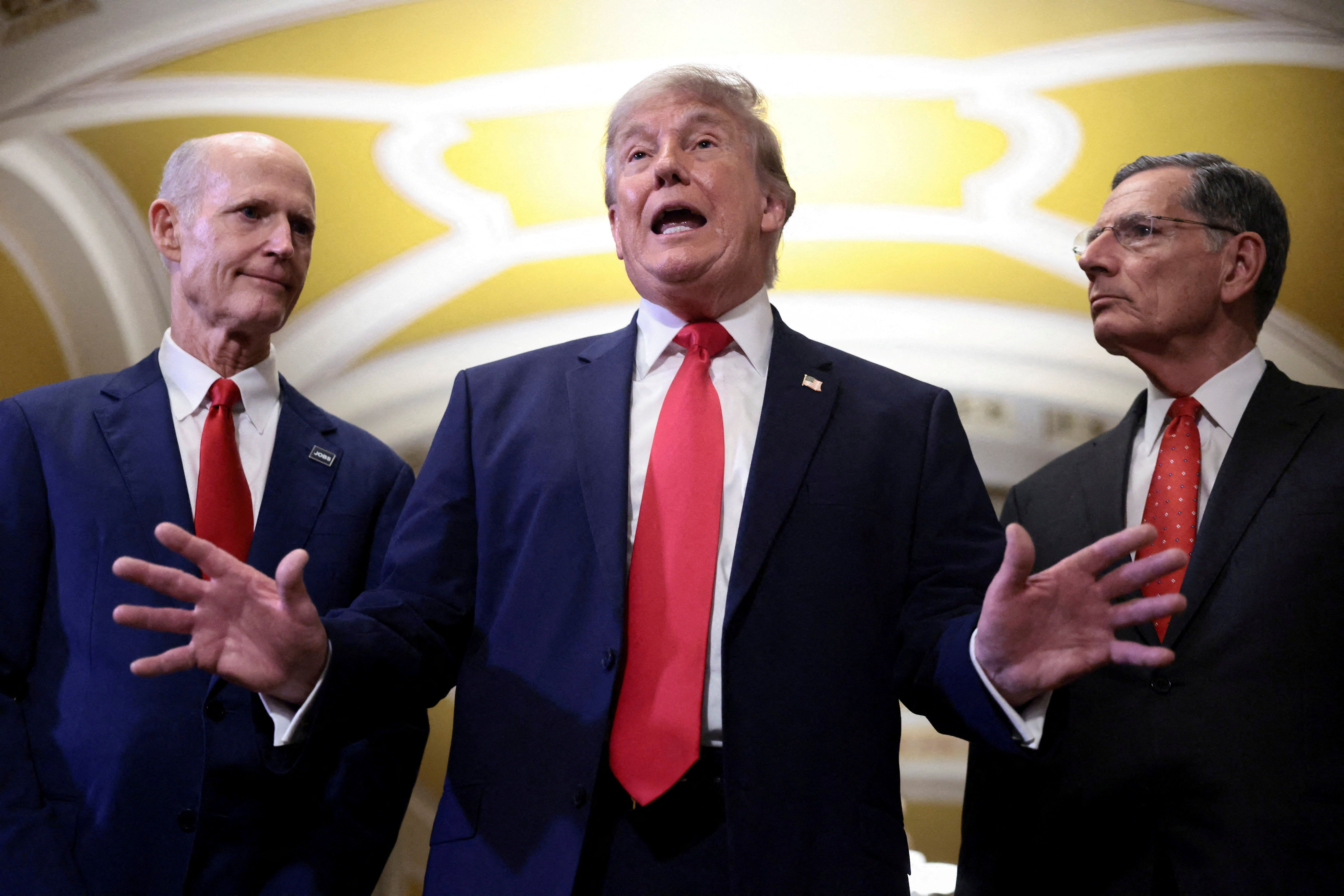 President Donald Trump speaks to reporters