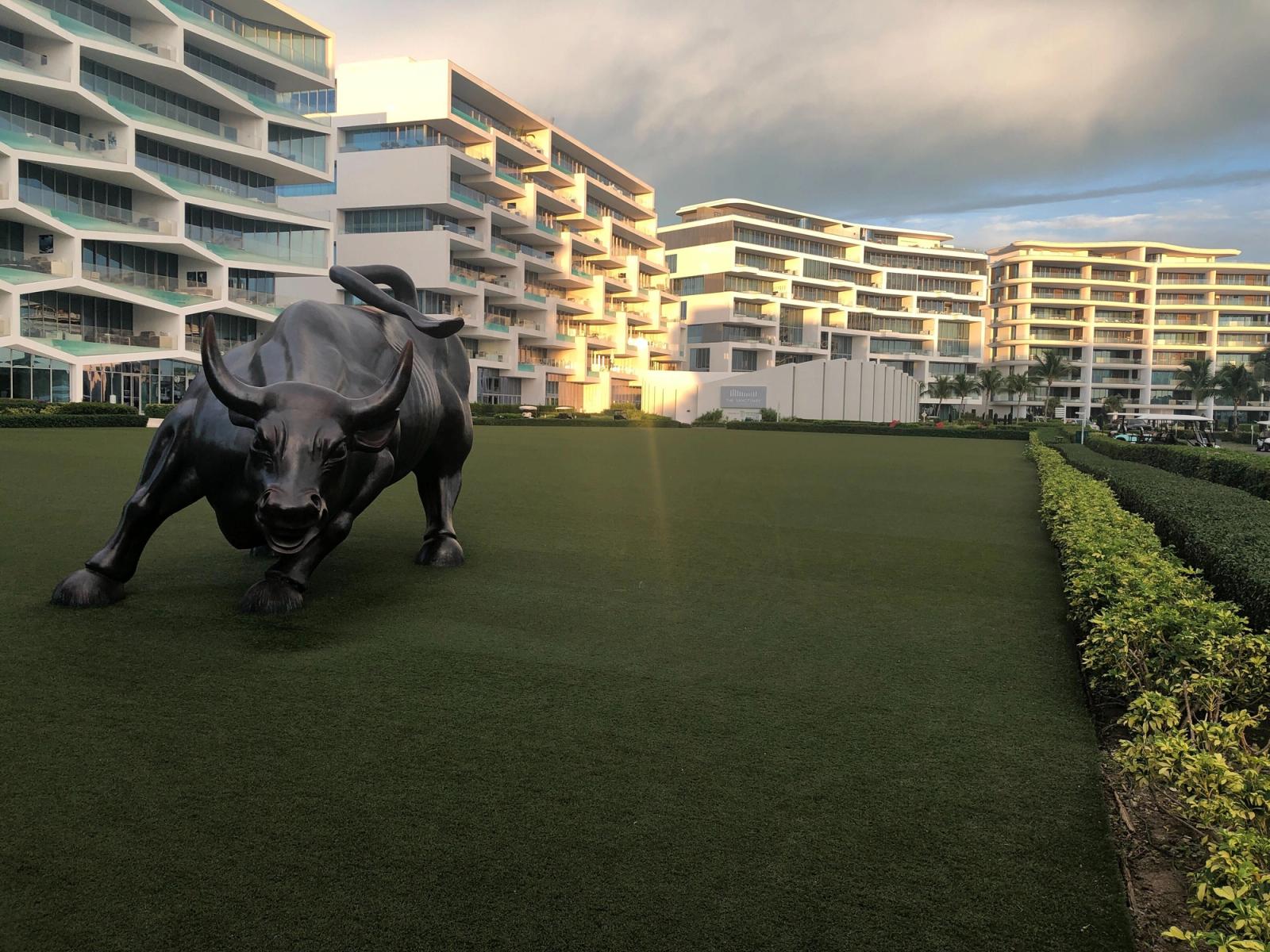 A replica of Wall Street's charging bull statue sits on the Albany resort's marina lawn.
