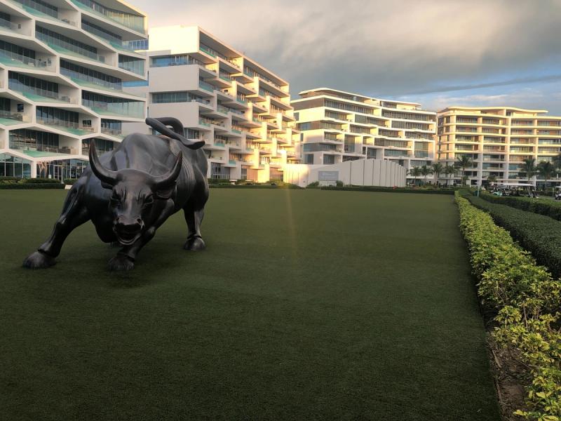 A replica of Wall Street’s charging bull statue sits on the Albany resort’s marina lawn.