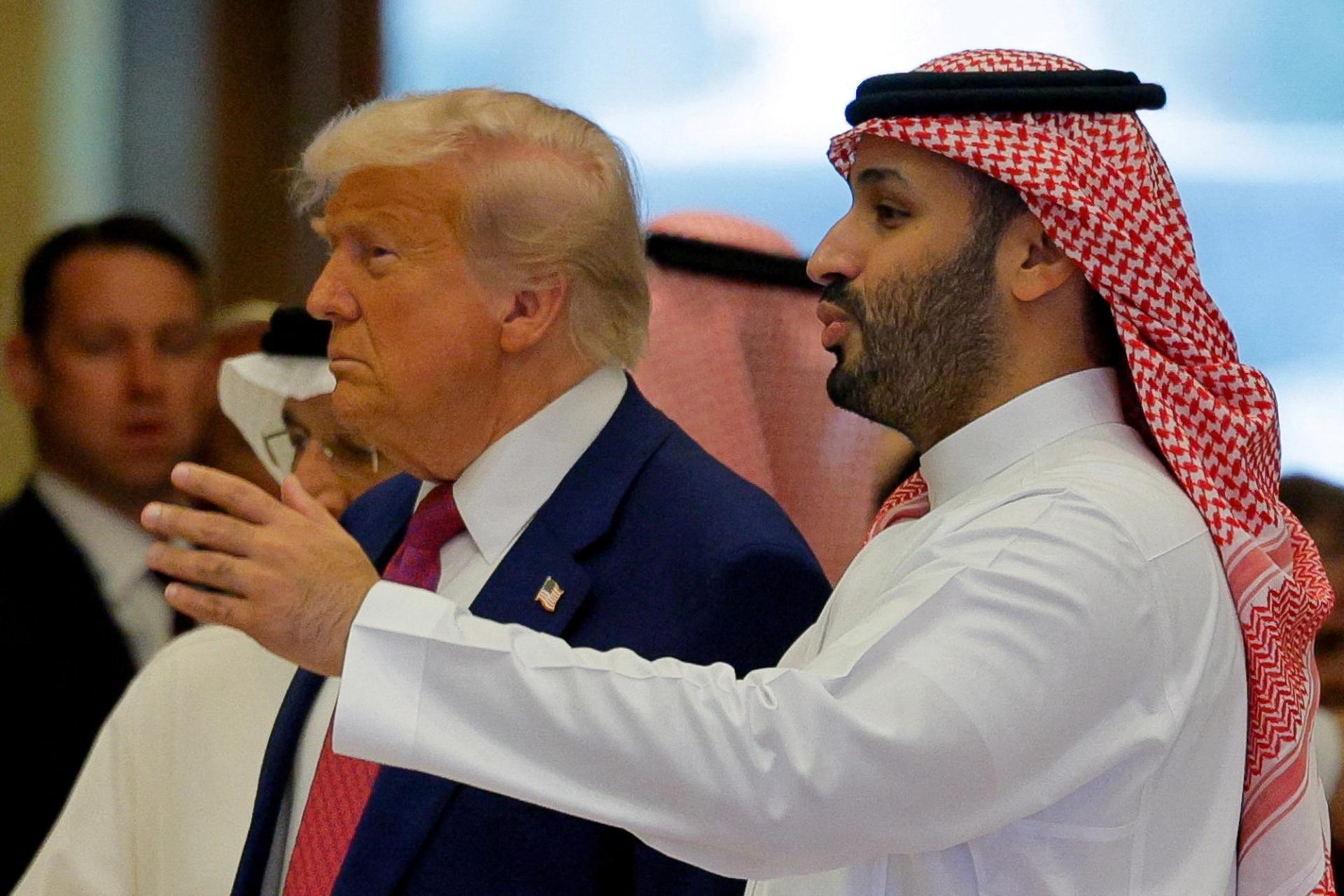 Saudi Crown Prince Mohammed Bin Salman speaks with U.S. President Donald Trump on the day of the Saudi-U.S. Investment Forum, in Riyadh, Saudi Arabia, May 13, 2025
