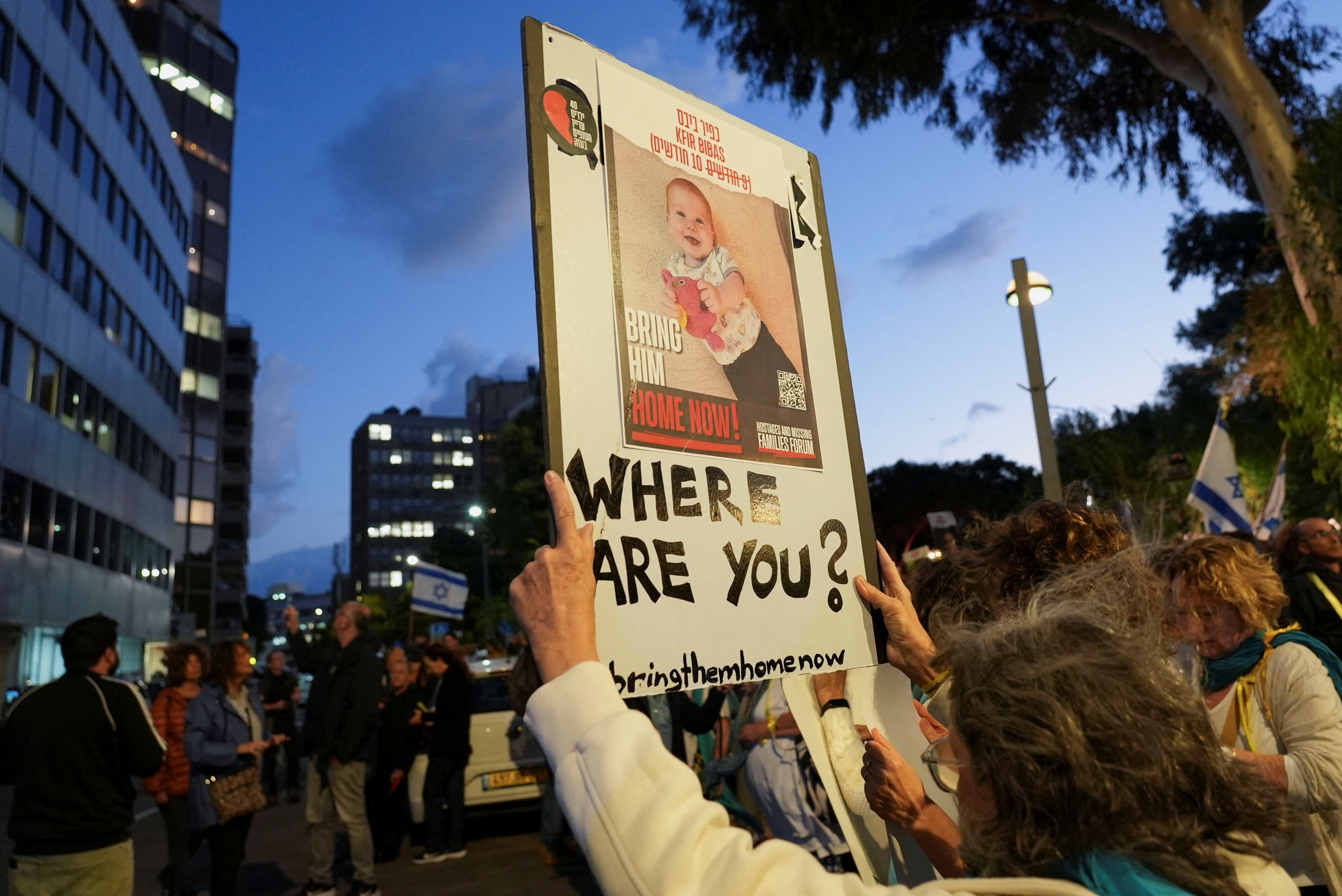 Protesters hold placards of Israeli child hostages outside the Tel Aviv offices of Nations International Children’s Emergency Fund (UNICEF), in Tel Aviv, Israel, November 20, 2023. 