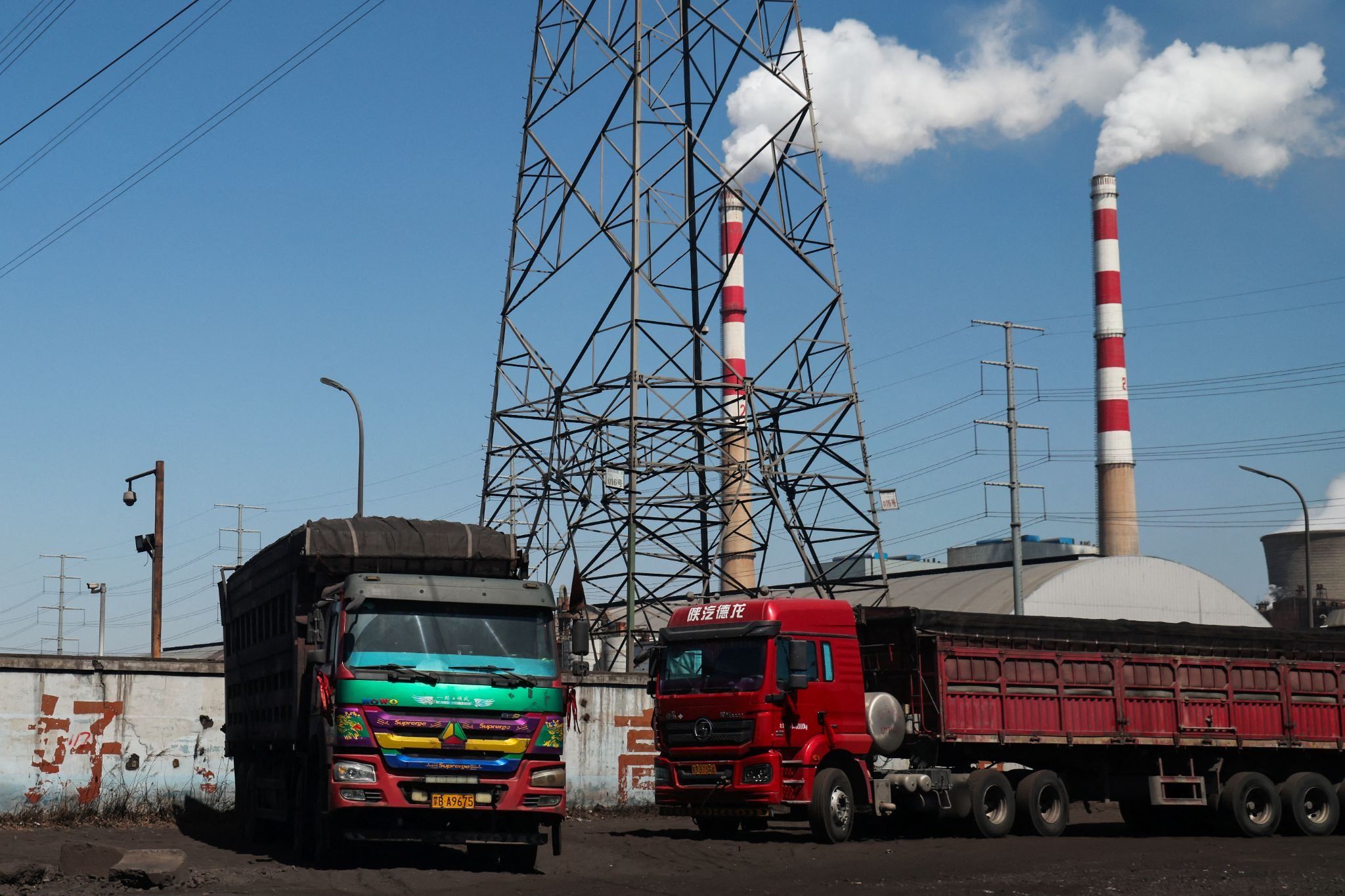 Trucks parked near a coal power plant in Baotou, Inner Mongolia, China. 