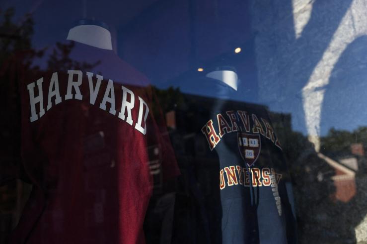 Harvard University merchandise stand in a window.