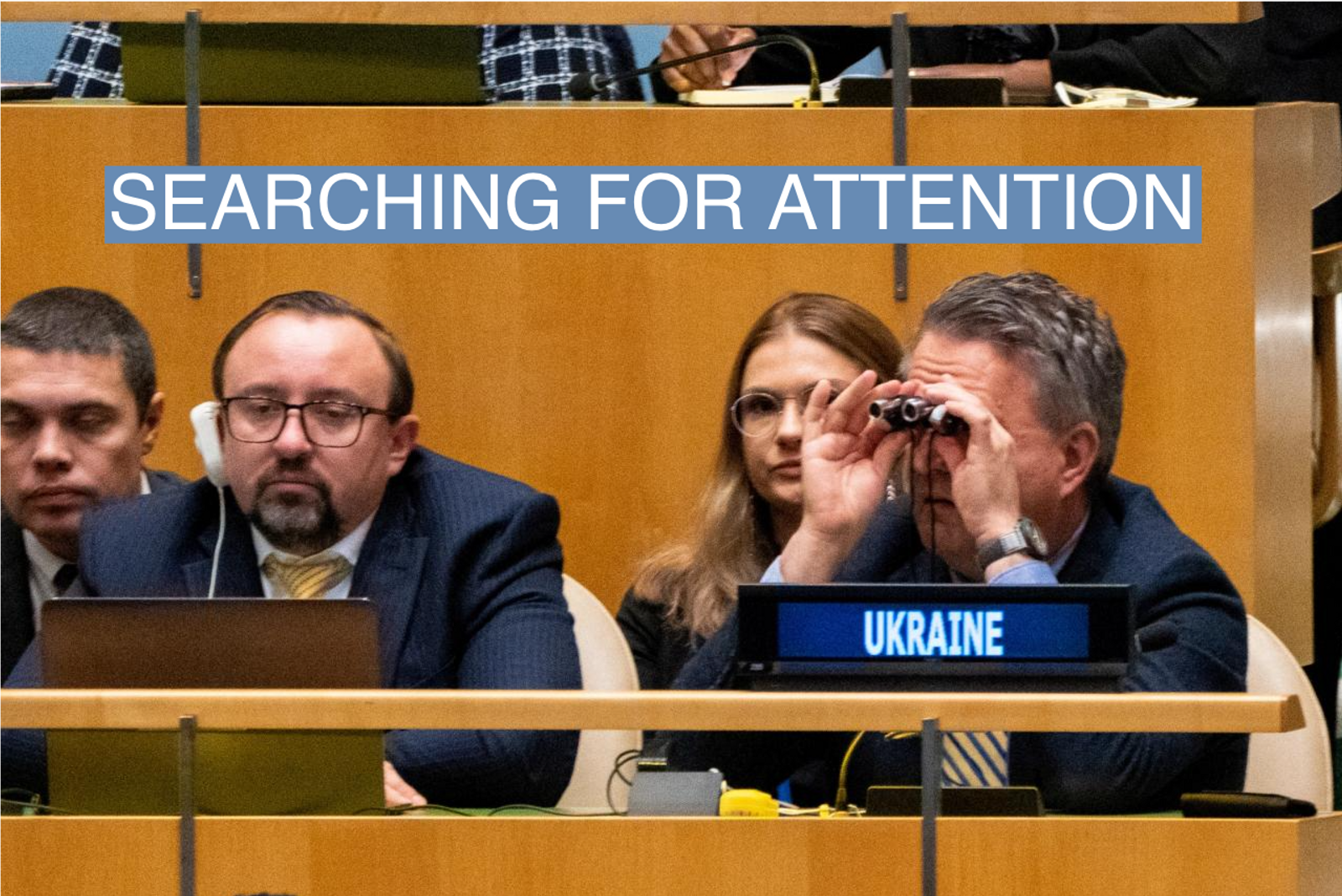 Ukrainian Ambassador to the U.N. Sergiy Kyslytsya scans the general assembly with binoculars