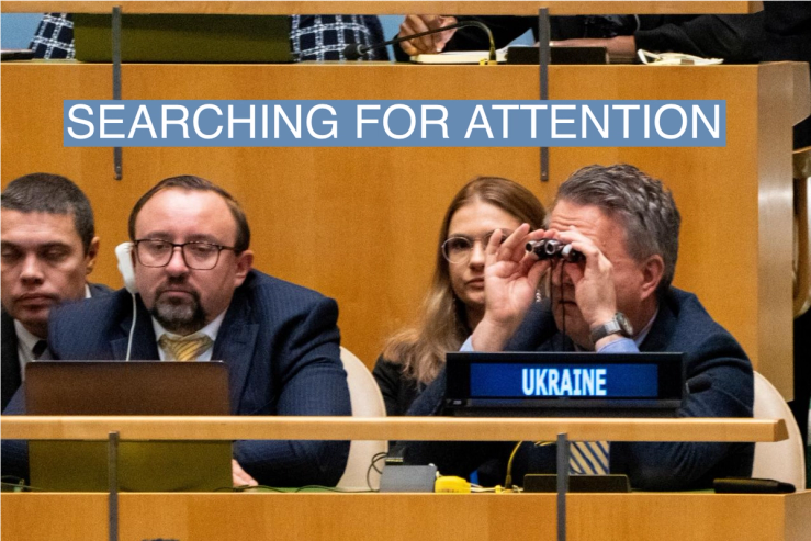 Ukrainian Ambassador to the U.N. Sergiy Kyslytsya scans the general assembly with binoculars