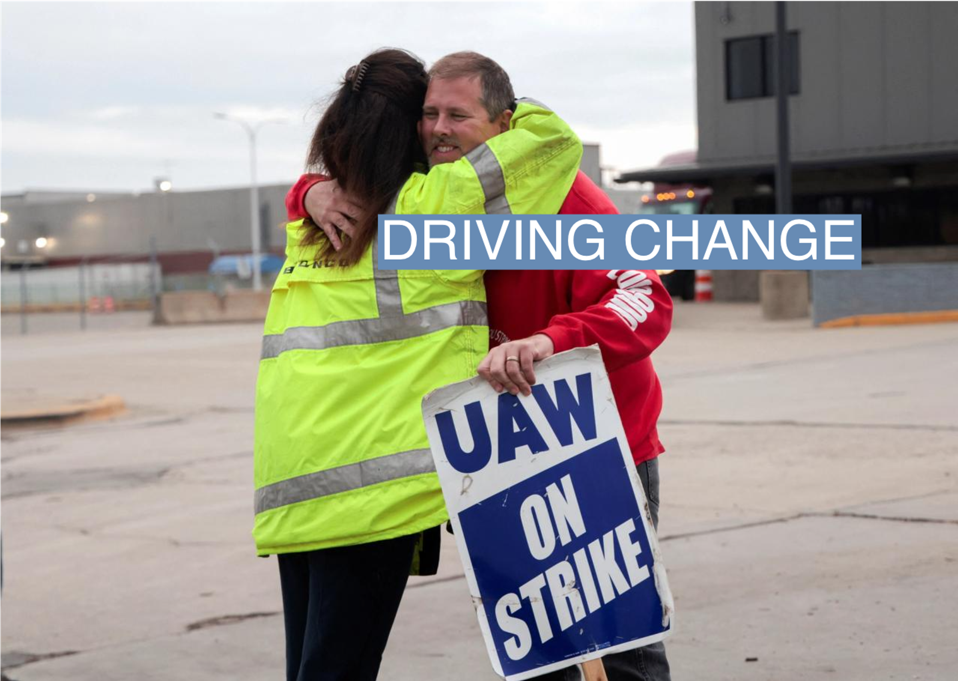 Striking United Auto Workers union members embrace at the end of their picket shift outside the Ford Michigan Assembly Plant in Wayne, Michigan, U.S., October 25, 2023. 