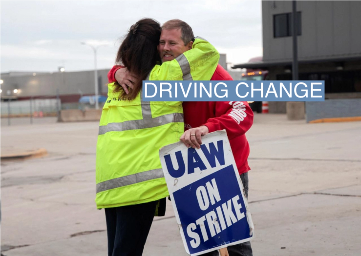 Striking United Auto Workers union members embrace at the end of their picket shift outside the Ford Michigan Assembly Plant in Wayne, Michigan, U.S., October 25, 2023.
