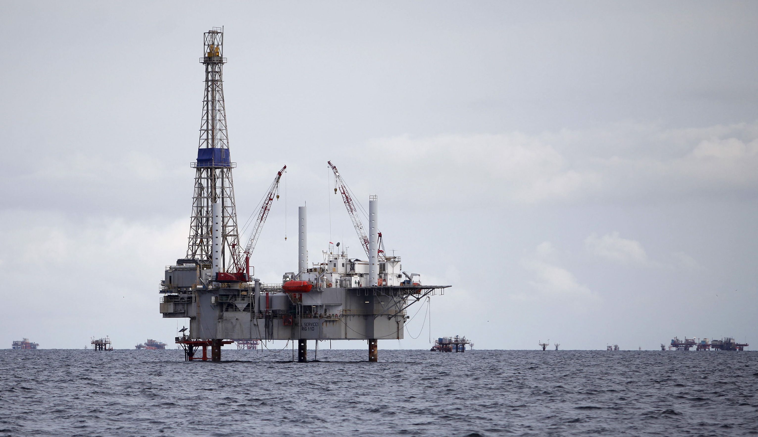A view of a drilling rig and distant production platform in the Soldado Field off Trinidad’s southwest coast.