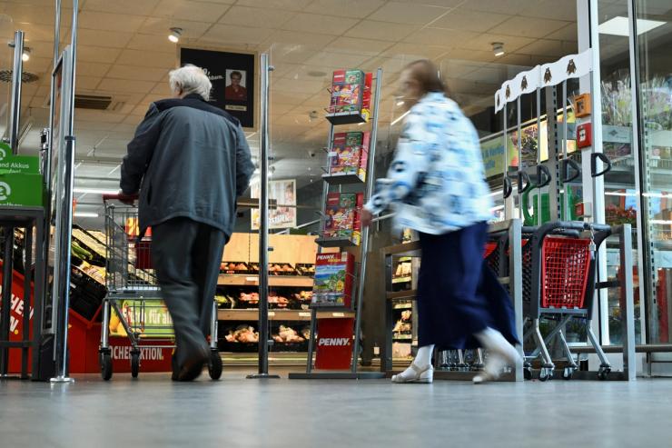 People enter a supermarket in Berlin, Germany.