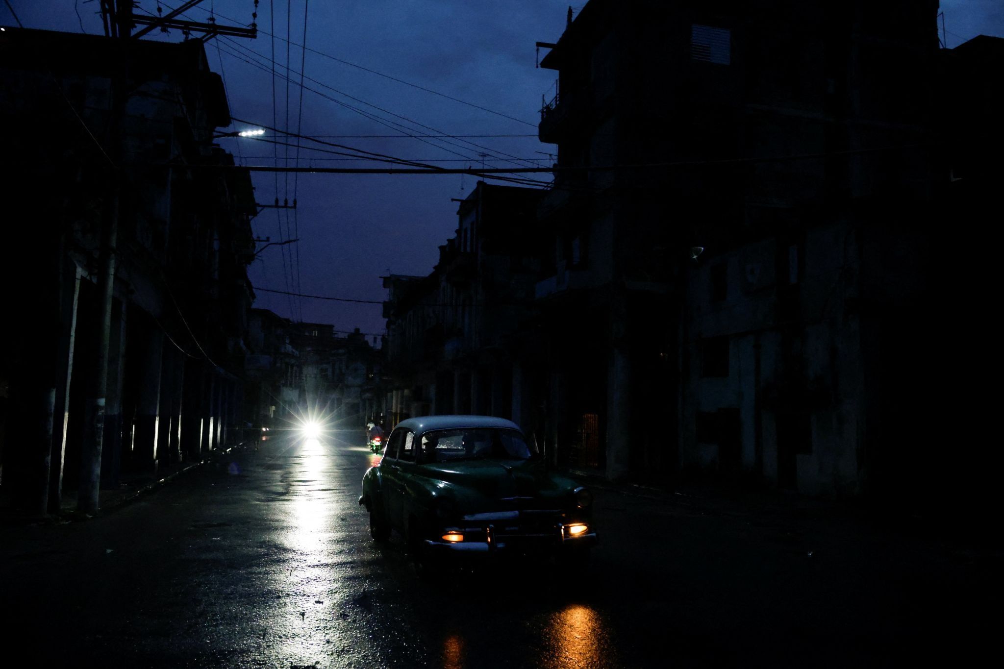 A vintage car moves as Cuba’s national electrical grid collapsed again. 