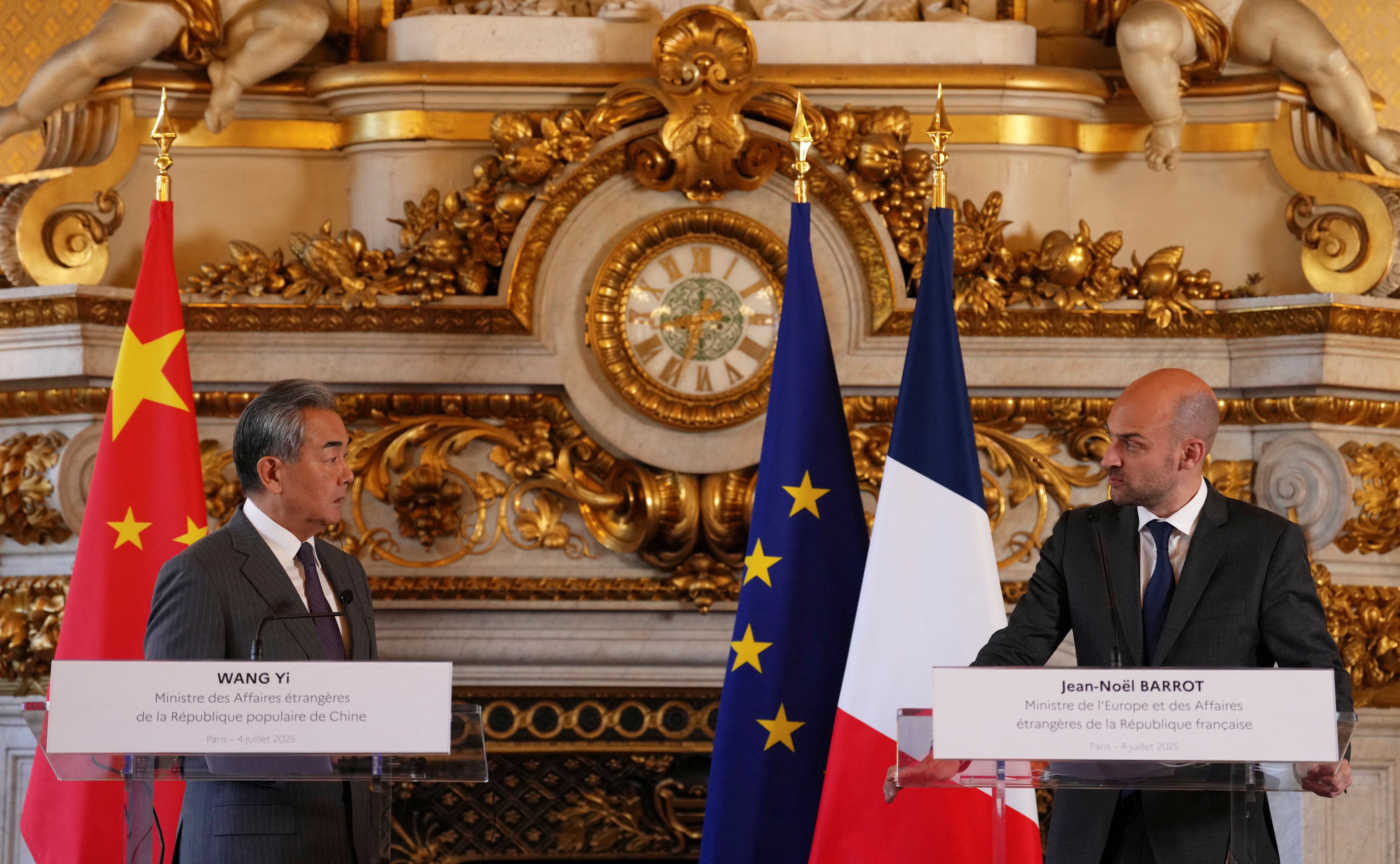 China’s and France’s foreign ministers at a news conference.