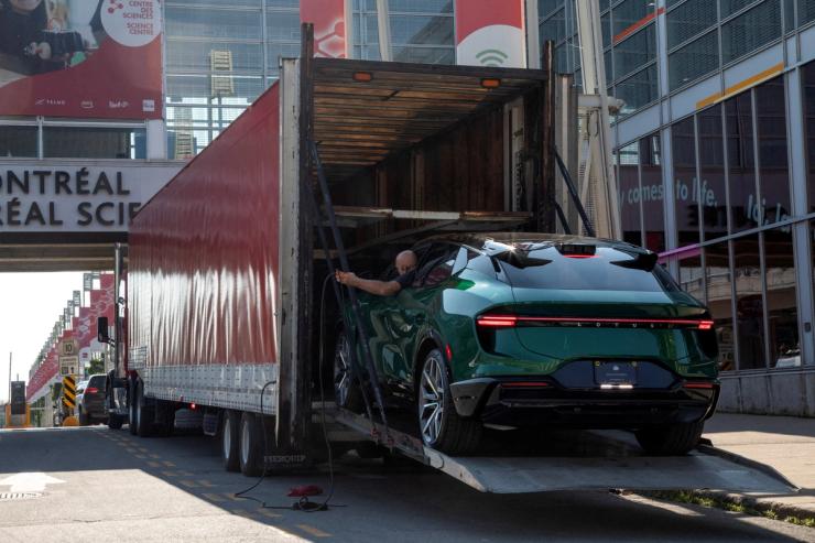 A Chinese EV is unloaded from a truck in Montreal.