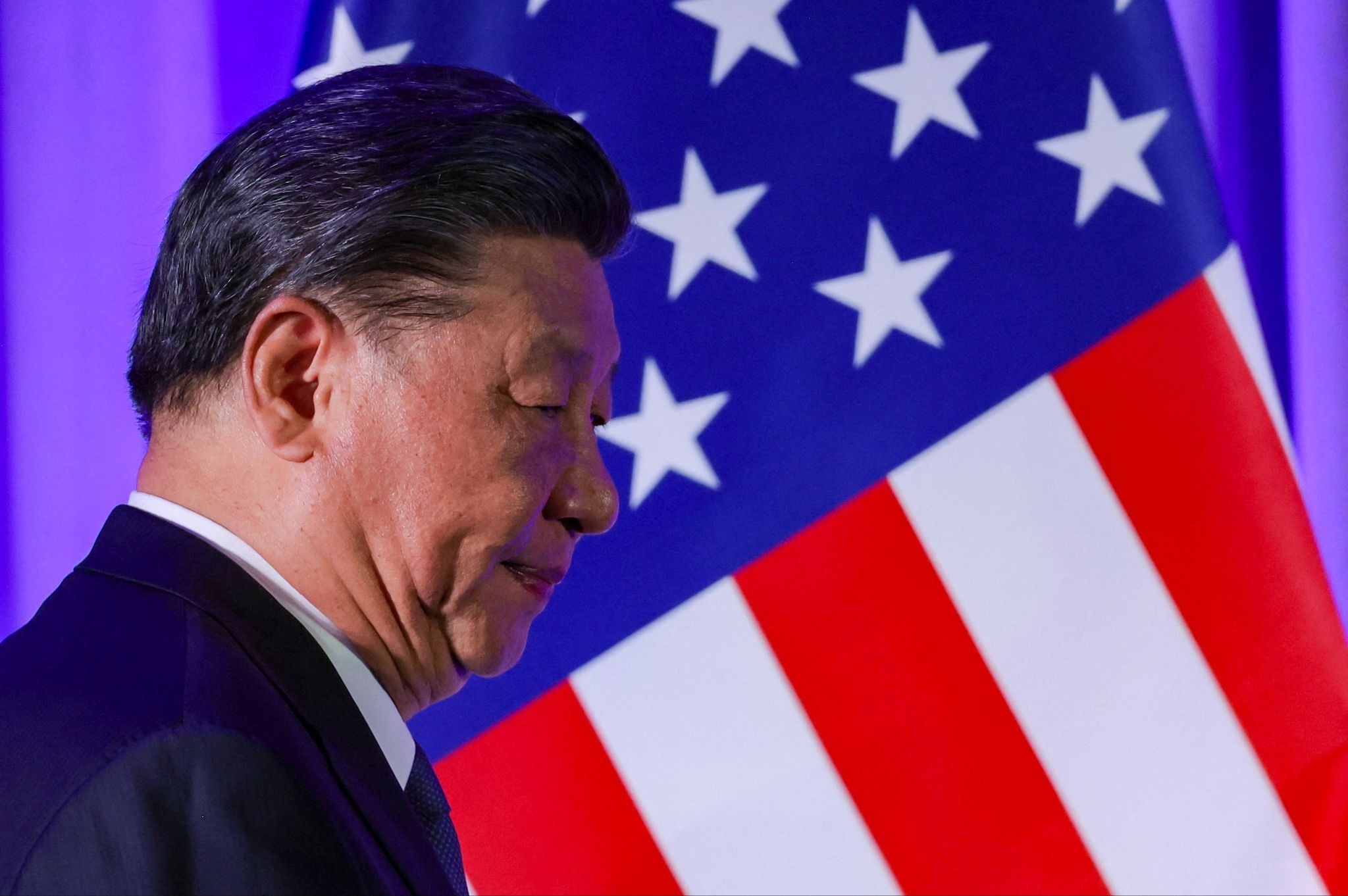 China’s leader Xi Jinping in front of a US flag in San Francisco