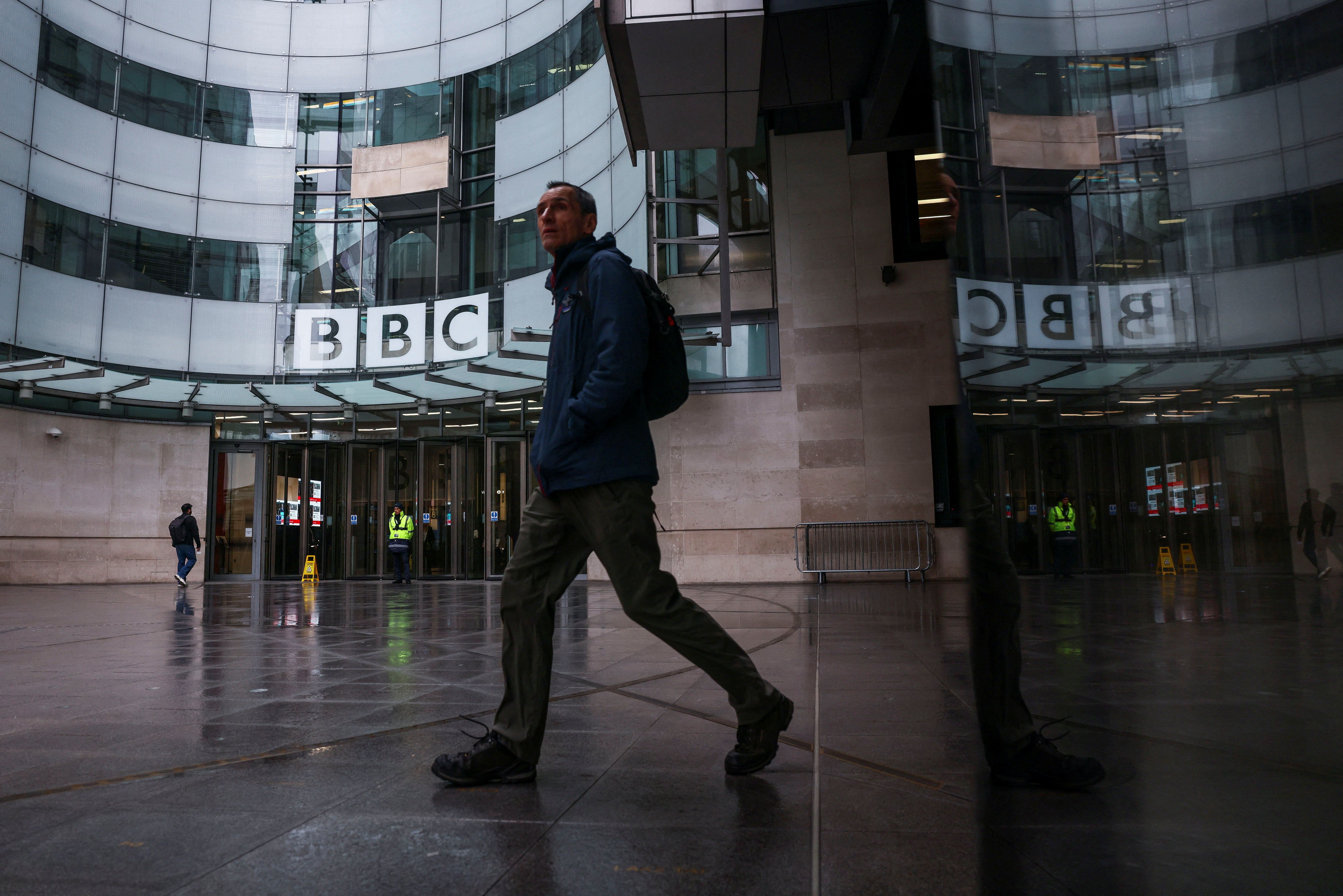 A person walks outside BBC Broadcasting House after Director General of BBC Tim Davie and Chief Executive of BBC News Deborah Turness resigned following accusations of bias at the British broadcaster
