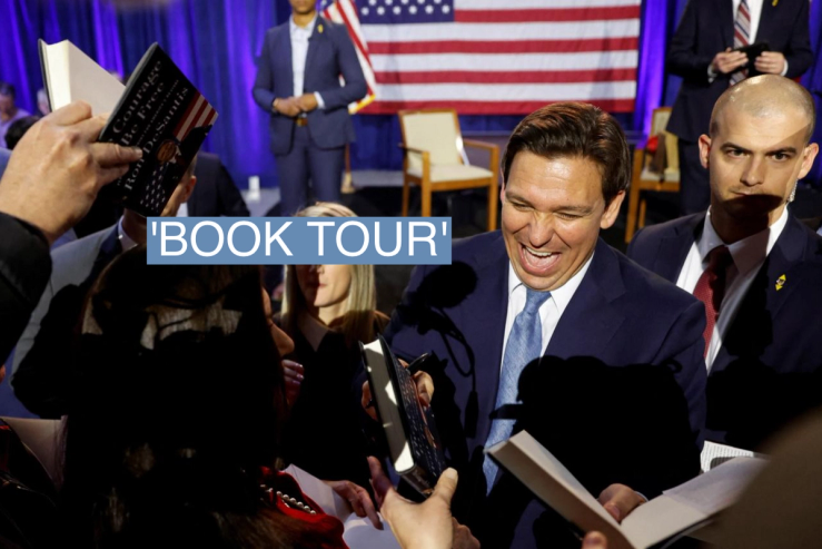 Ron DeSantis signs copies of his book in Iowa.
