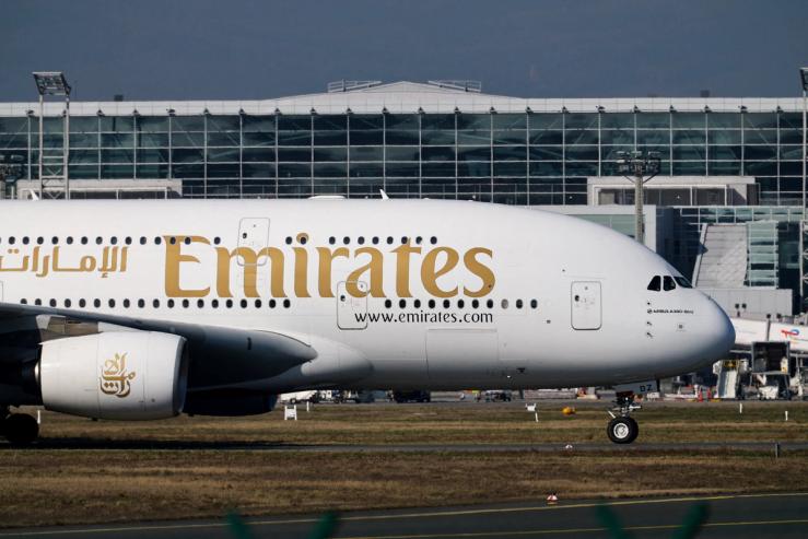 An Emirates plane with German tourists evacuated from the Middle East arrives from Dubai.