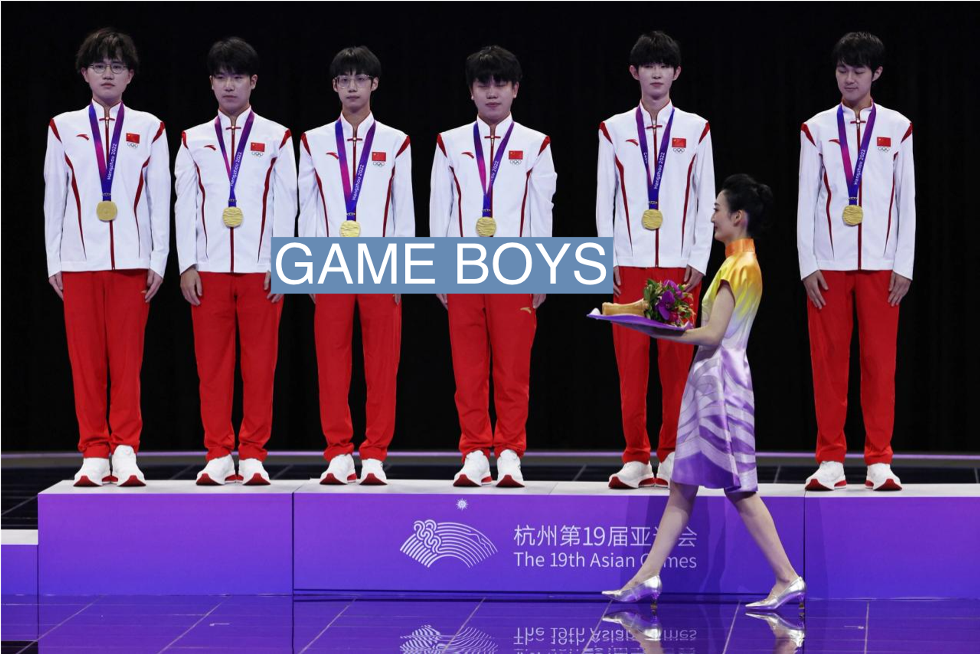Team China with gold medals after winning the Arena of Valor game in the esposts event at the Asian Games
