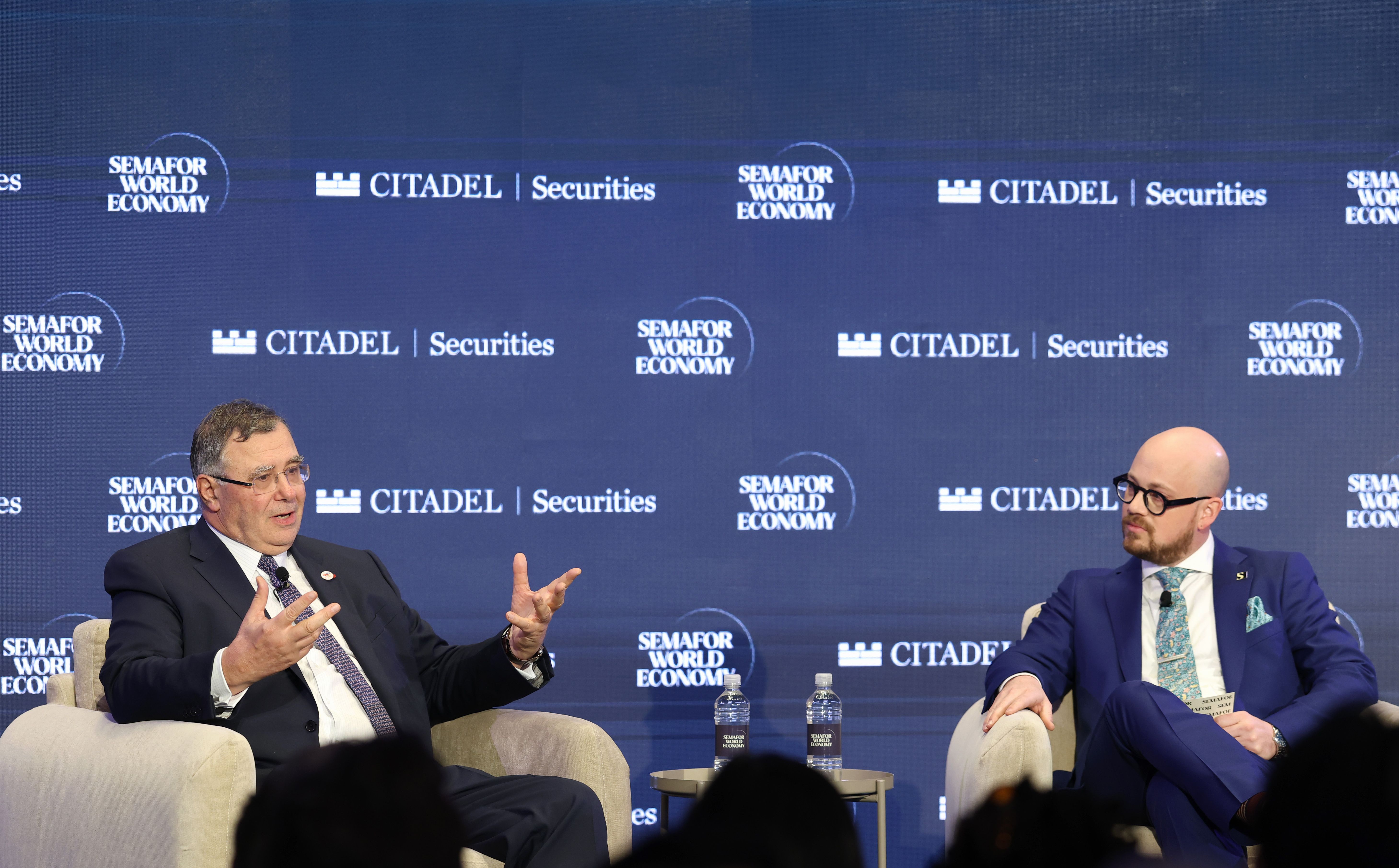 Patrick Pouyanné (L) and Semafor’s Tim McDonnell