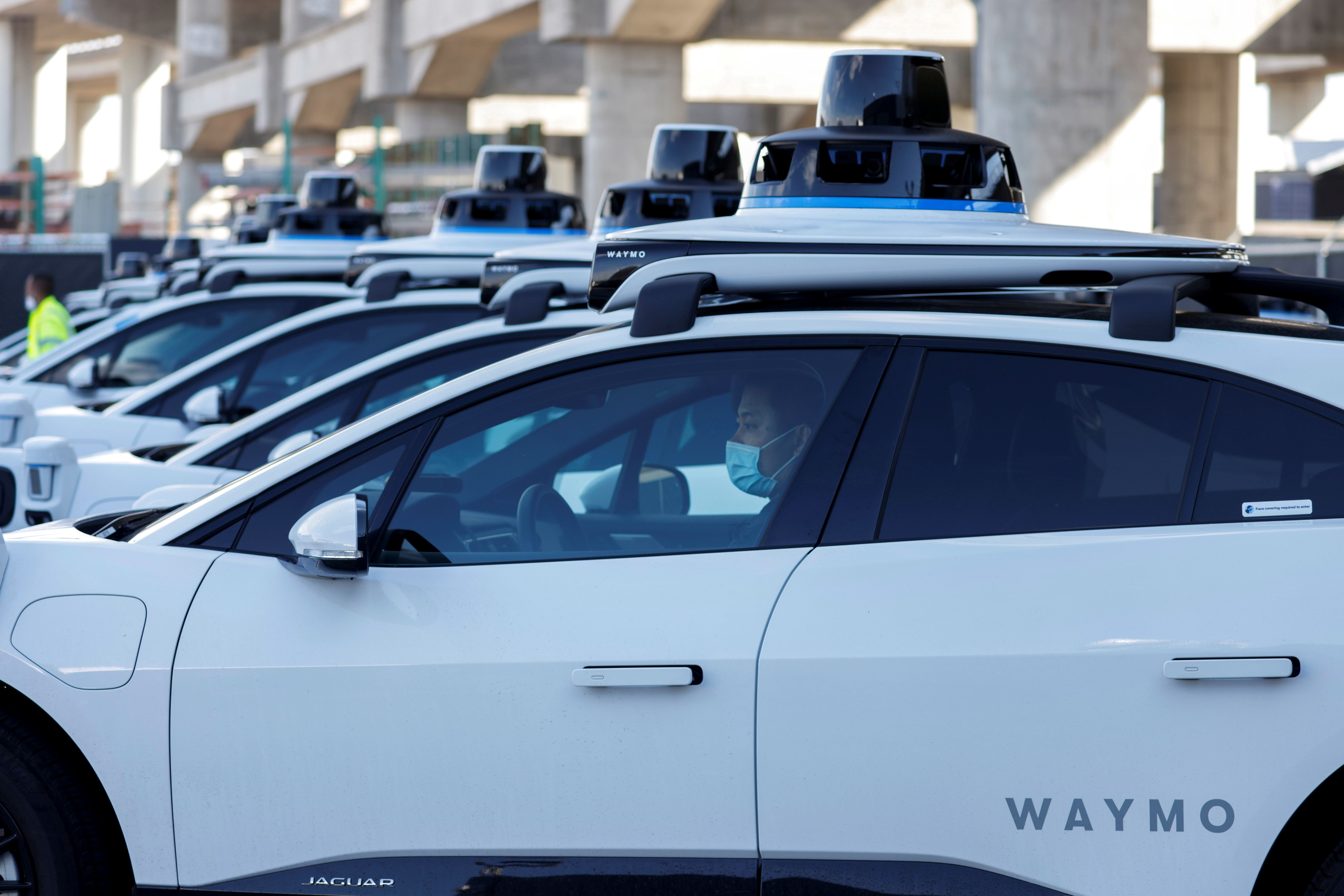 Waymo cars lined up.