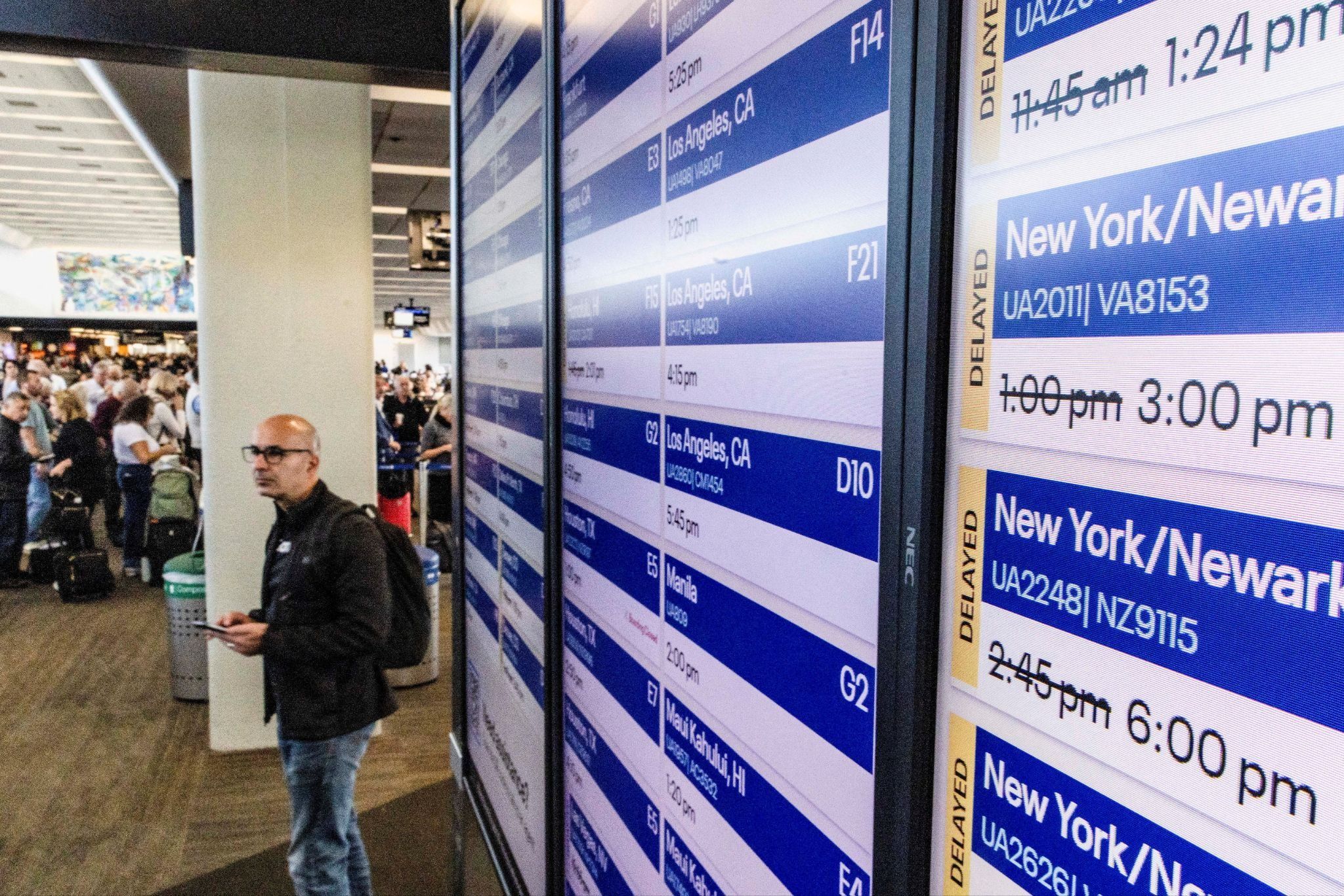 Signs showing canceled flights at an airport