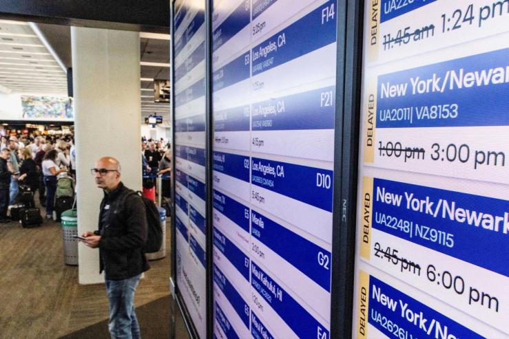 Signs showing canceled flights at an airport