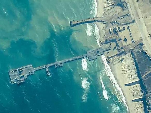 Members of the US Army, US Navy and the Israeli military put in place the temporary Trident Pier to deliver humanitarian aid to Gaza on May 16, 2024.