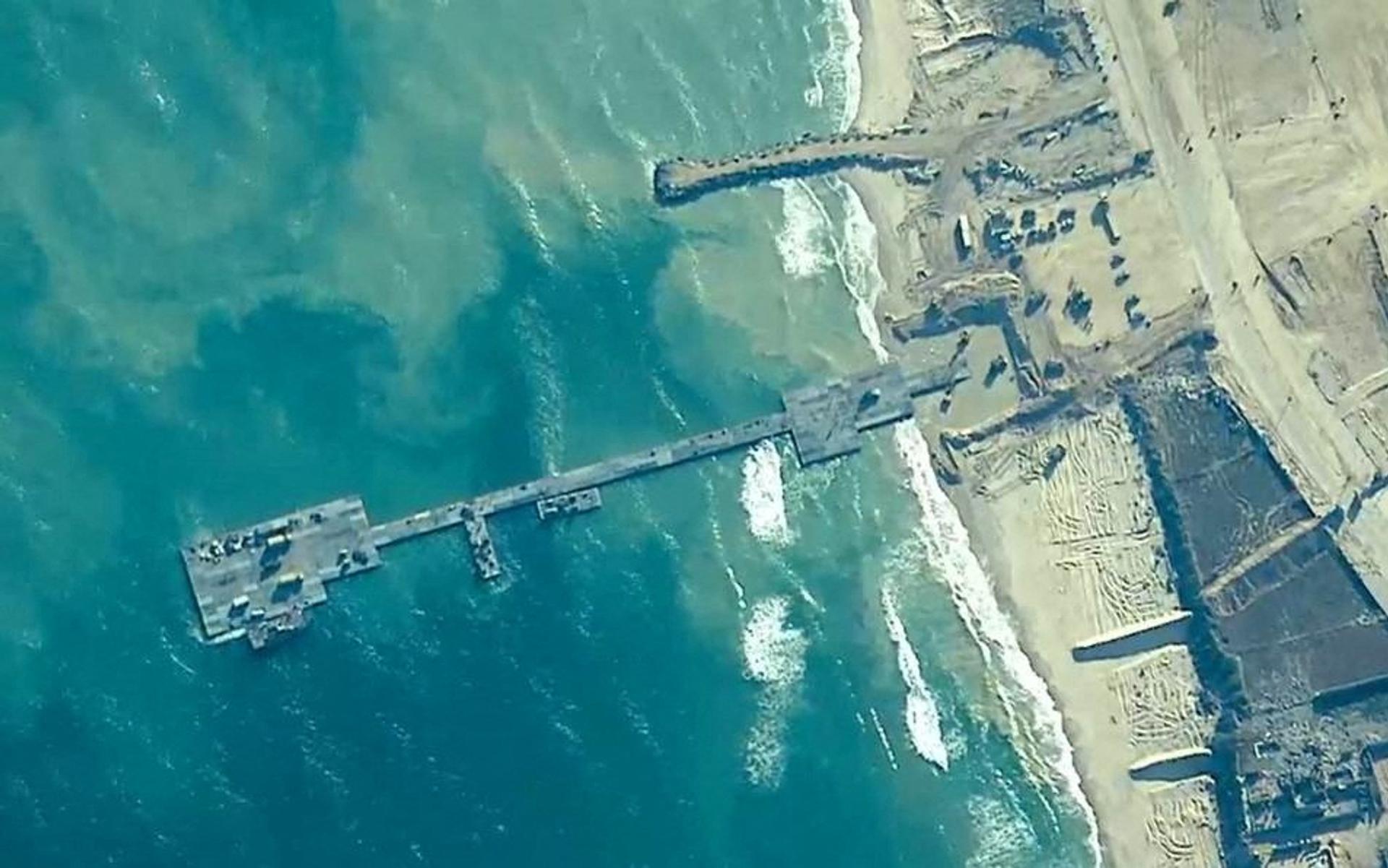 Members of the US Army, US Navy and the Israeli military put in place the temporary Trident Pier to deliver humanitarian aid to Gaza on May 16, 2024.