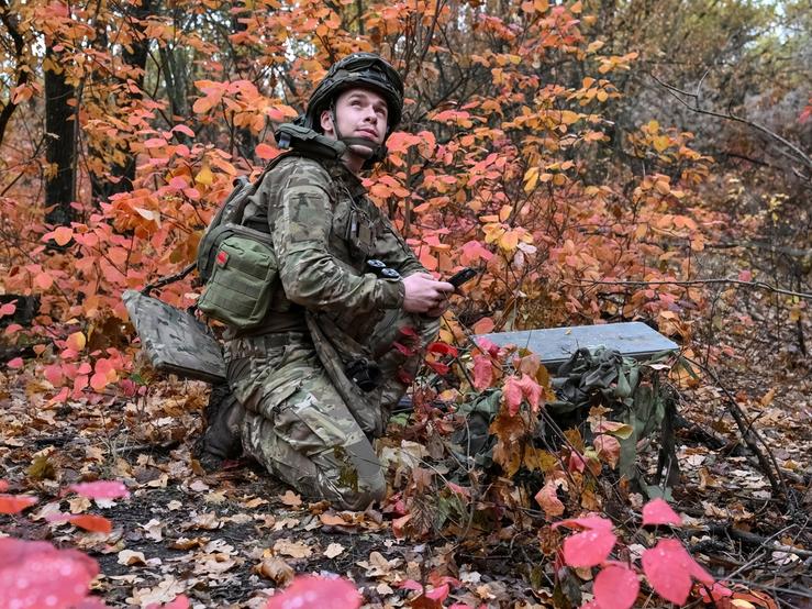 An artilleryman of the Special Rifle Police Battalion of Zaporizhzhia region sets up Starlink satellite internet system, , near the frontline in Donetsk region, Ukraine