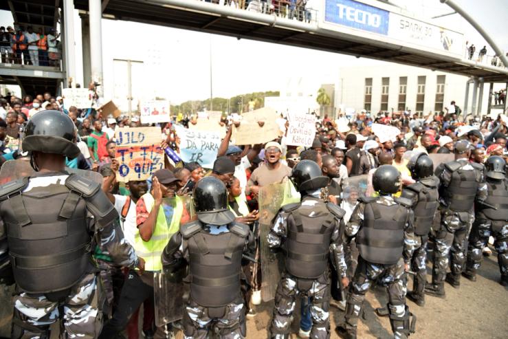 Angola anti-riot police officers stand in formation as protesters gather in Luanda on July 26, 2025.