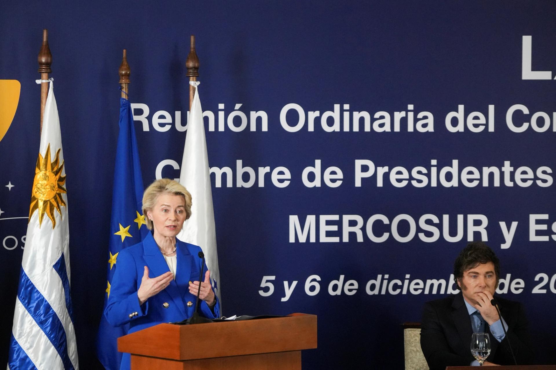 European Commission President Ursula von der Leyen speaks as Argentina’s President Javier Milei looks on, at the Mercosur Summit in Montevideo, Uruguay December 6, 2024.