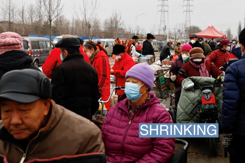 Elderly people shop ahead of the Chinese Lunar New Year at an outdoor market in Beijing, China January 13, 2023.