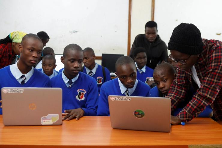 Renice Owino, founder of Code with Kids, directs pupils on a laptop during a coding lesson at the Raila Educational Centre in Kibera district of Nairobi, Kenya May 31, 2023.