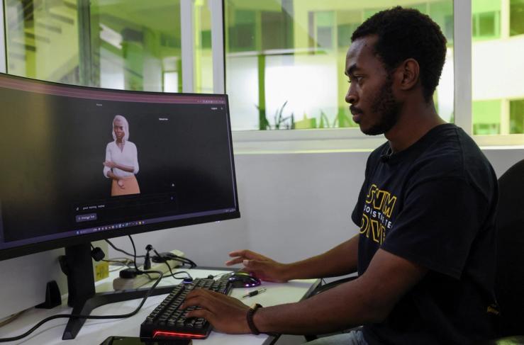 Signvrse data scientist Anthony Githinji works on an avatar, part of an AI-powered sign language translation technology designed to bridge communication gaps for deaf people, in Nairobi, Kenya.