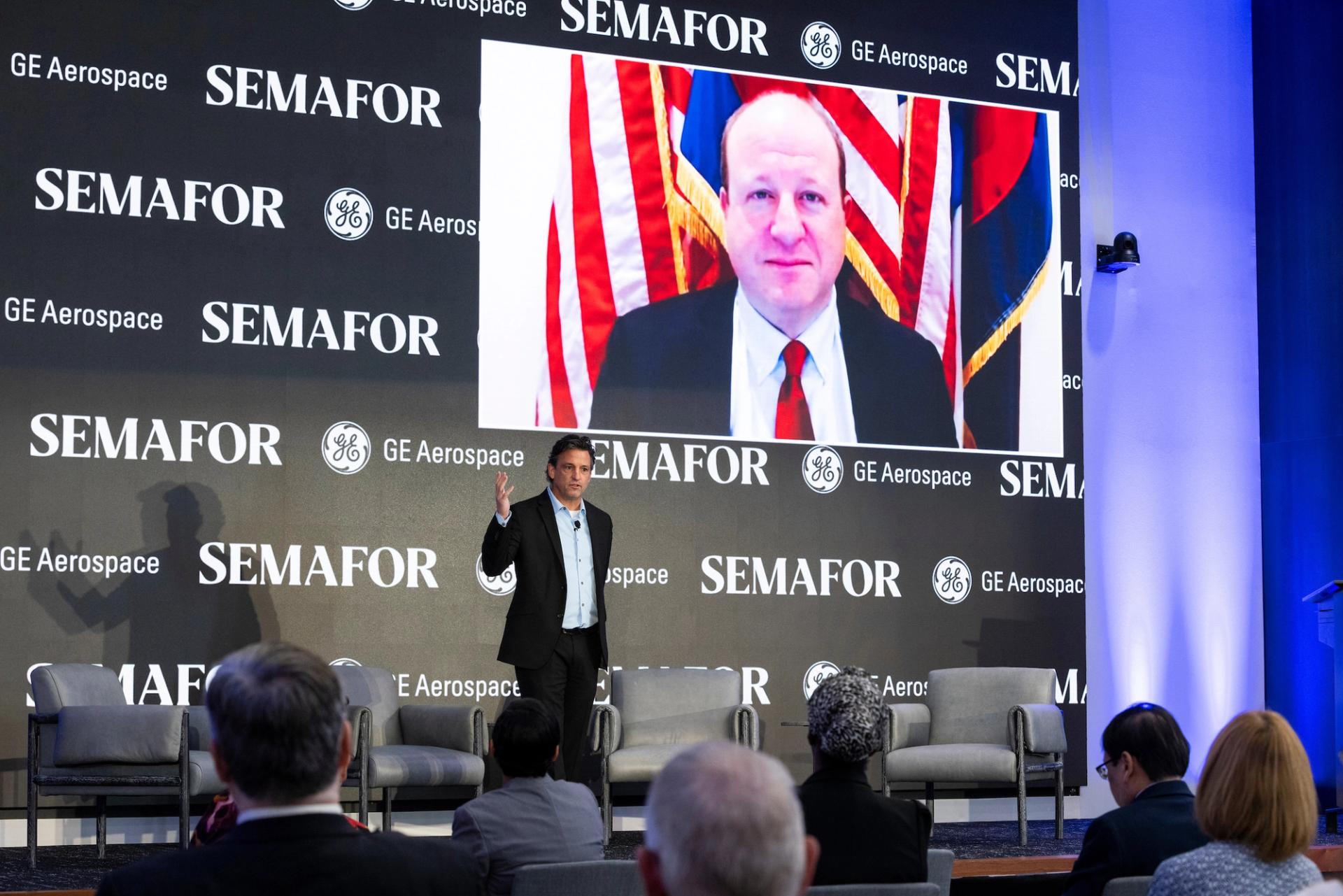 Colorado Gov. Jared Polis speaking remotely during a Semafor event to Jon Hilsenrath