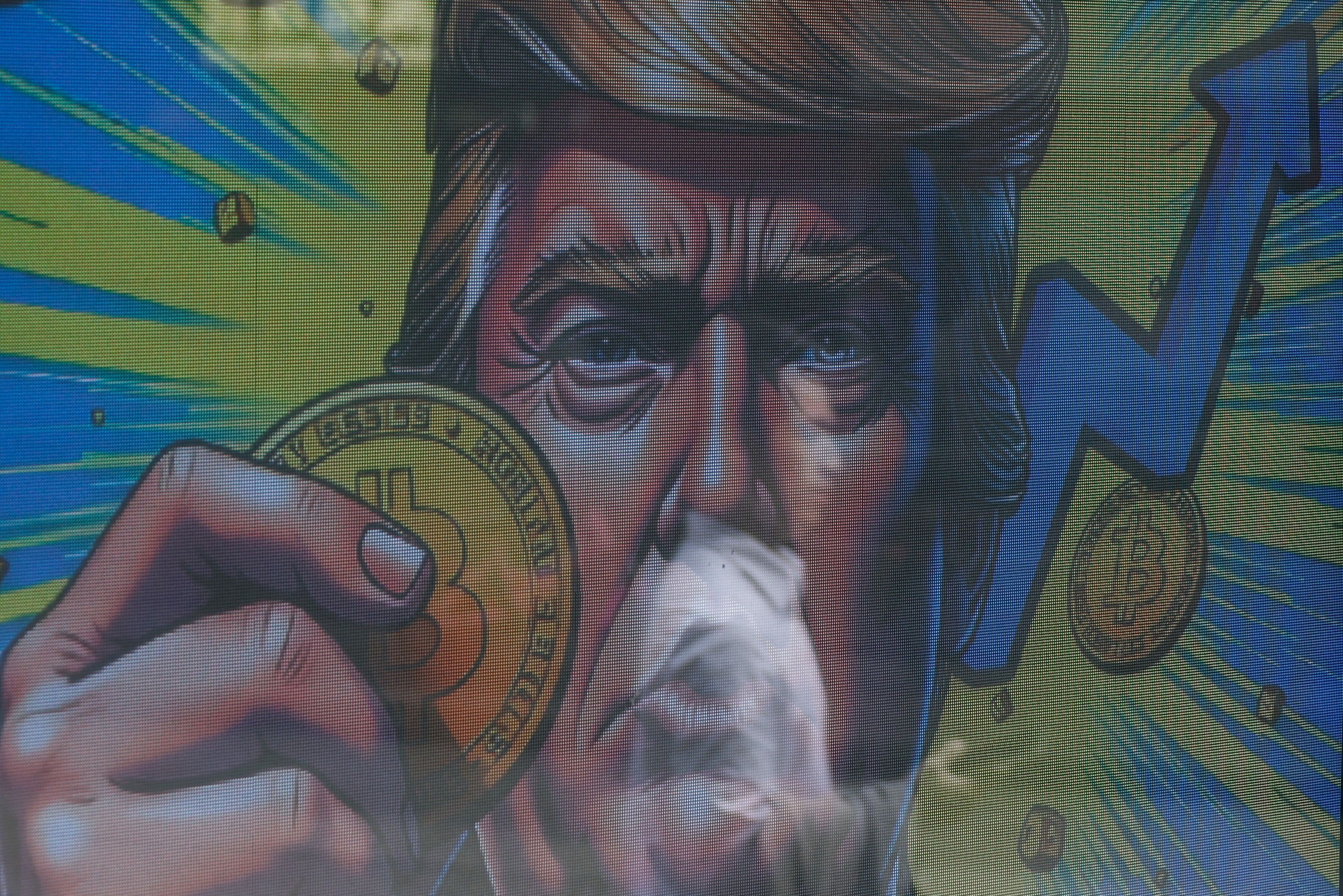 A mural with Trump holding a Bitcoin 